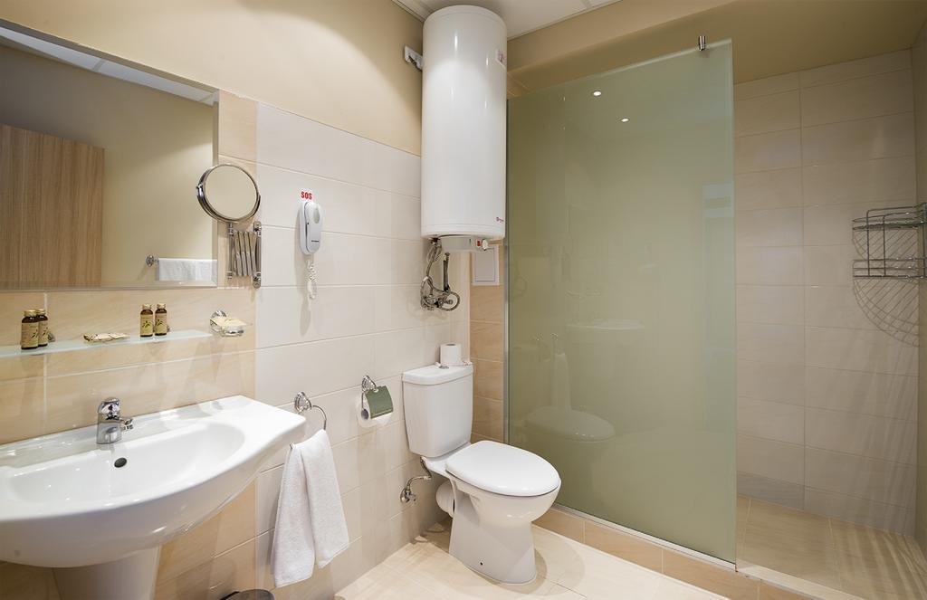 One-Bedroom Apartment with Balcony and Partial Sea View (2 Adults + 2 Children)